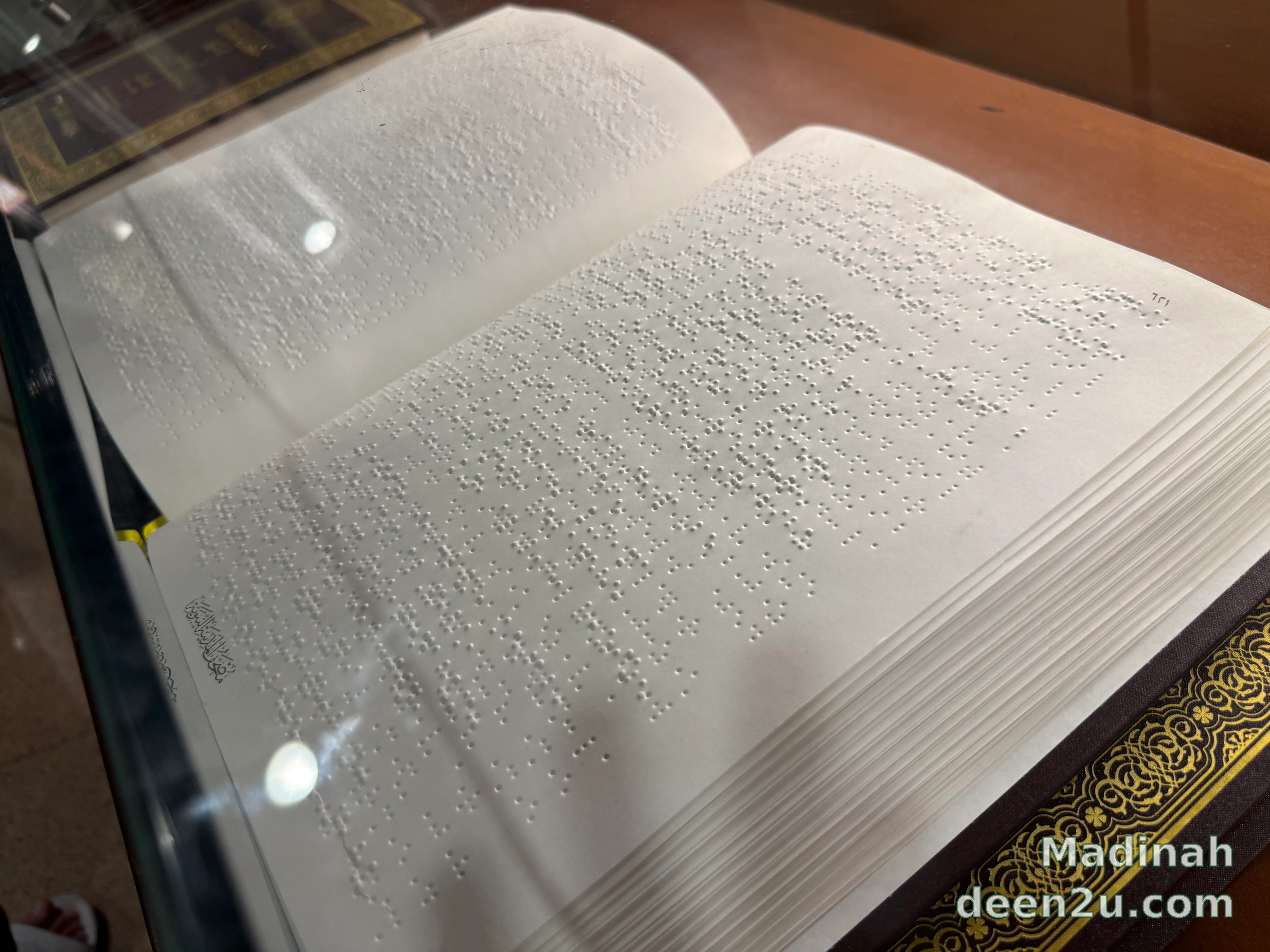 A Braille copy of the Holy Quran, its pages raised for reading by touch.